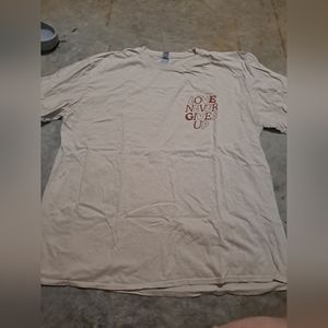 "Love Never Gives Up" graphic tshirt